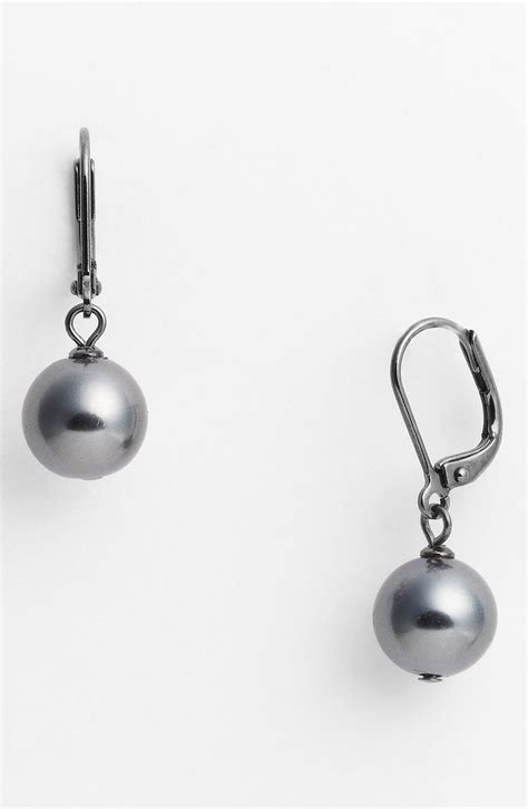 givenchy glass pearl drop earrings|Givenchy cat earrings.